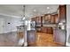 Modern kitchen with stainless steel appliances, granite countertops, and dark wood cabinets at 9 Oatgrass Dr, Grayson, GA 30017