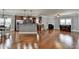 Spacious living room features hardwood floors, fireplace, and a seamless connection to the kitchen at 9 Oatgrass Dr, Grayson, GA 30017