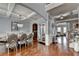Open floor plan view of living room showcasing hardwood floors, a window, and dining room in the background at 9 Oatgrass Dr, Grayson, GA 30017