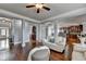 Bright living room with hardwood floors leads to the kitchen and dining area at 9 Oatgrass Dr, Grayson, GA 30017