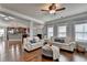 Open-concept living room features hardwood floors, lots of windows, and natural light at 9 Oatgrass Dr, Grayson, GA 30017
