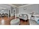 Living room view to dining room, showcasing hardwood floors, neutral wall paint and comfortable seating at 9 Oatgrass Dr, Grayson, GA 30017