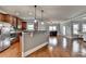 Bright open living area featuring hardwood floors, stainless steel appliances, and seamless connection to dining at 9 Oatgrass Dr, Grayson, GA 30017