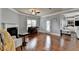 Inviting living room with hardwood floors, fireplace, and open layout with a seamless connection to other rooms at 9 Oatgrass Dr, Grayson, GA 30017