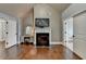 Vaulted ceiling main bedroom featuring a fireplace and vanity with mirror at 9 Oatgrass Dr, Grayson, GA 30017
