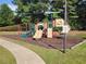 A vibrant playground offers children a fun and safe space to play with slides, swings, and climbing equipment at 9 Oatgrass Dr, Grayson, GA 30017