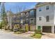 Exterior view showcasing gray facade townhouses, with colorful doors and well-maintained landscaping at 951 Glenwood Se Ave # 3104, Atlanta, GA 30316