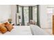 Comfortable main bedroom with bay windows, neutral colors, and stylish furnishings at 951 Glenwood Se Ave # 3104, Atlanta, GA 30316