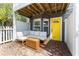 Inviting patio featuring a comfortable sectional sofa and a vibrant yellow door at 951 Glenwood Se Ave # 3104, Atlanta, GA 30316