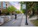 Scenic street view with Glenwood Park sign, bike lane, modern condos, and lush greenery enhancing the urban landscape at 951 Glenwood Se Ave # 3104, Atlanta, GA 30316