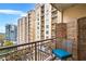 Charming balcony with a view of the surrounding buildings, planters, and seating at 1101 Juniper Ne St # 922, Atlanta, GA 30309