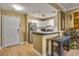 Condo kitchen with bright white cabinets, stainless steel appliances, and warm, neutral paint at 1101 Juniper Ne St # 922, Atlanta, GA 30309