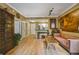 Inviting living room featuring hardwood floors, modern lighting, tan walls and stylish decor at 1101 Juniper Ne St # 922, Atlanta, GA 30309