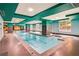 Inviting indoor swimming pool with tiled deck and clear, turquoise water at 1101 Juniper Ne St # 922, Atlanta, GA 30309