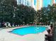 Serene outdoor pool area with comfortable lounge chairs and lush greenery at 1101 Juniper Ne St # 922, Atlanta, GA 30309