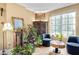 Cozy sitting area with large window, comfortable chairs and stylish decor, showcasing city views at 1101 Juniper Ne St # 922, Atlanta, GA 30309