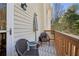 Outdoor balcony with two chairs, an umbrella, and string lights for relaxing at 1119 Glenridge Pl, Atlanta, GA 30342