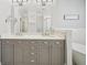 Elegant double vanity in a bright and luxurious bathroom with large mirrors at 1119 Glenridge Pl, Atlanta, GA 30342