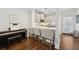 Modern kitchen with stainless steel appliances, white cabinetry, and breakfast bar at 1119 Glenridge Pl, Atlanta, GA 30342