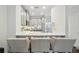Modern kitchen featuring bar seating, quartz countertops and stainless appliances at 1119 Glenridge Pl, Atlanta, GA 30342