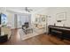 Inviting living room featuring hardwood floors, ceiling fan, and stylish decor at 1119 Glenridge Pl, Atlanta, GA 30342