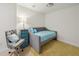 Cozy guest room with a comfortable daybed, stylish chair, and blue dresser at 1119 Glenridge Pl, Atlanta, GA 30342