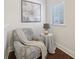 Cozy sitting area with a comfortable chair, side table and large window at 1119 Glenridge Pl, Atlanta, GA 30342