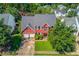 An aerial view showcasing this property's manicured lawn, mature trees and neighborhood at 1312 Woodland View Rd, Lawrenceville, GA 30043