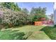 A spacious backyard featuring a deck and green lawn at 1312 Woodland View Rd, Lawrenceville, GA 30043