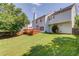 Lush green backyard with a wooden deck, perfect for outdoor enjoyment at 1312 Woodland View Rd, Lawrenceville, GA 30043
