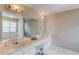 Bright bathroom with double sinks, a large mirror, and a bathtub at 1312 Woodland View Rd, Lawrenceville, GA 30043