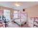 Bedroom with a canopy bed, and plenty of natural light at 1312 Woodland View Rd, Lawrenceville, GA 30043