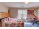 Bedroom featuring natural light, hardwood floors, and a playful basketball slide at 1312 Woodland View Rd, Lawrenceville, GA 30043