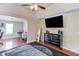 Bright main bedroom with a ceiling fan, hardwood floors, and a large dresser at 1312 Woodland View Rd, Lawrenceville, GA 30043