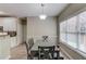 Eat-in kitchen dining area featuring a window, a table with seating and access to the bar top at 1312 Woodland View Rd, Lawrenceville, GA 30043