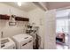 Well-organized laundry area with modern appliances and convenient shelving at 1312 Woodland View Rd, Lawrenceville, GA 30043