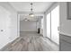 Spacious room with neutral walls and an view to the kitchen, bathed in natural light at 145 Silver Mine Trl, Austell, GA 30168