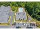 A picturesque aerial view of the community clubhouse, pool, and lush landscaping at 2565 Grapevine Cir # 103, Cumming, GA 30041