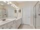 Bathroom with double sink vanity and a glass-enclosed shower at 2565 Grapevine Cir # 103, Cumming, GA 30041