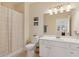 Bright bathroom with a shower/tub, toilet, and vanity at 2565 Grapevine Cir # 103, Cumming, GA 30041