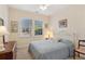 Cozy bedroom featuring neutral walls, natural light, and classic furniture at 2565 Grapevine Cir # 103, Cumming, GA 30041