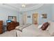 Bright bedroom with dresser, ceiling fan and ensuite bathroom at 2565 Grapevine Cir # 103, Cumming, GA 30041