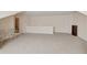 Expansive bonus room showcasing its potential as a flexible living space at 2565 Grapevine Cir # 103, Cumming, GA 30041