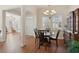 Cozy dining area with a view of the living room, enhancing a seamless flow of space at 2565 Grapevine Cir # 103, Cumming, GA 30041
