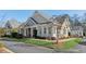 Charming single-story home featuring large windows, well-manicured lawn, and inviting curb appeal at 2565 Grapevine Cir # 103, Cumming, GA 30041