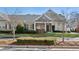 Attractive single-story home with a covered porch, tidy landscaping, and a welcoming entrance at 2565 Grapevine Cir # 103, Cumming, GA 30041
