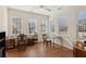 Sunlit living area featuring wood floors and large windows, creating a welcoming atmosphere at 2565 Grapevine Cir # 103, Cumming, GA 30041