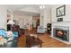 Comfortable living room with hardwood floors, fireplace, and vaulted ceilings at 2565 Grapevine Cir # 103, Cumming, GA 30041