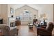 Comfortable living room features a fireplace, vaulted ceilings, and plenty of natural light at 2565 Grapevine Cir # 103, Cumming, GA 30041