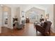 Inviting living room with cozy seating and fireplace, bathed in natural light, great for relaxing at 2565 Grapevine Cir # 103, Cumming, GA 30041
